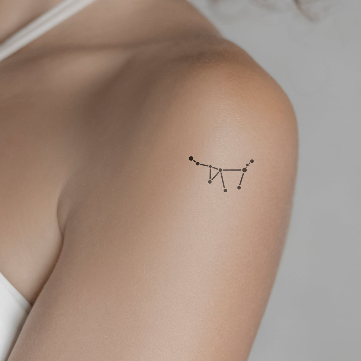 Capricornus constellation and crescent moon tattoo on