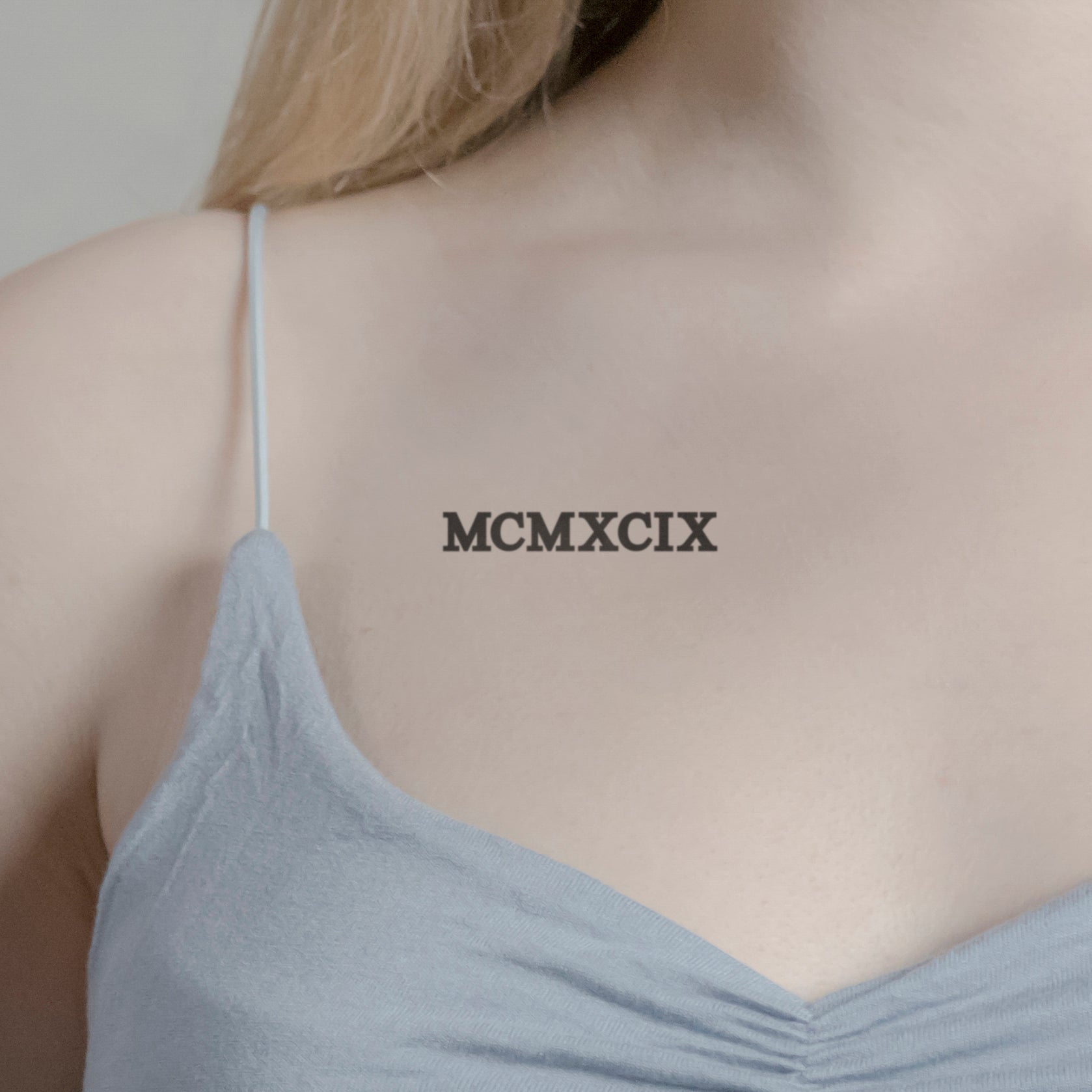 Zahlen Tattoo Römische Zahl MCMXCIX (1999) von minink, der Marke für temporäre Tattoos.