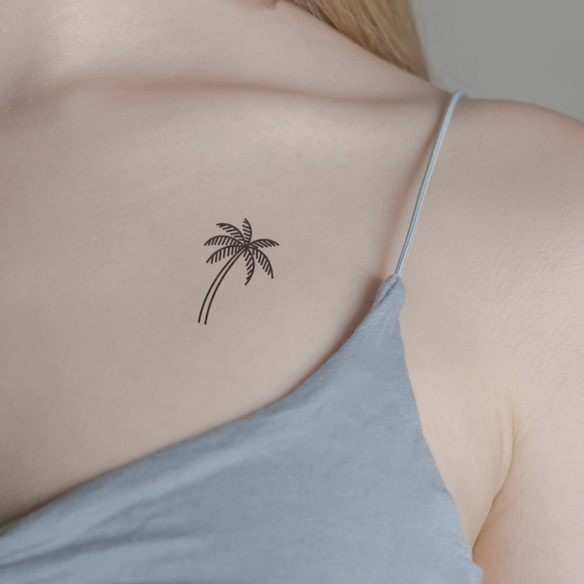 Palme schattierte Blätter Tattoo von minink, der Marke für temporäre Tattoos.