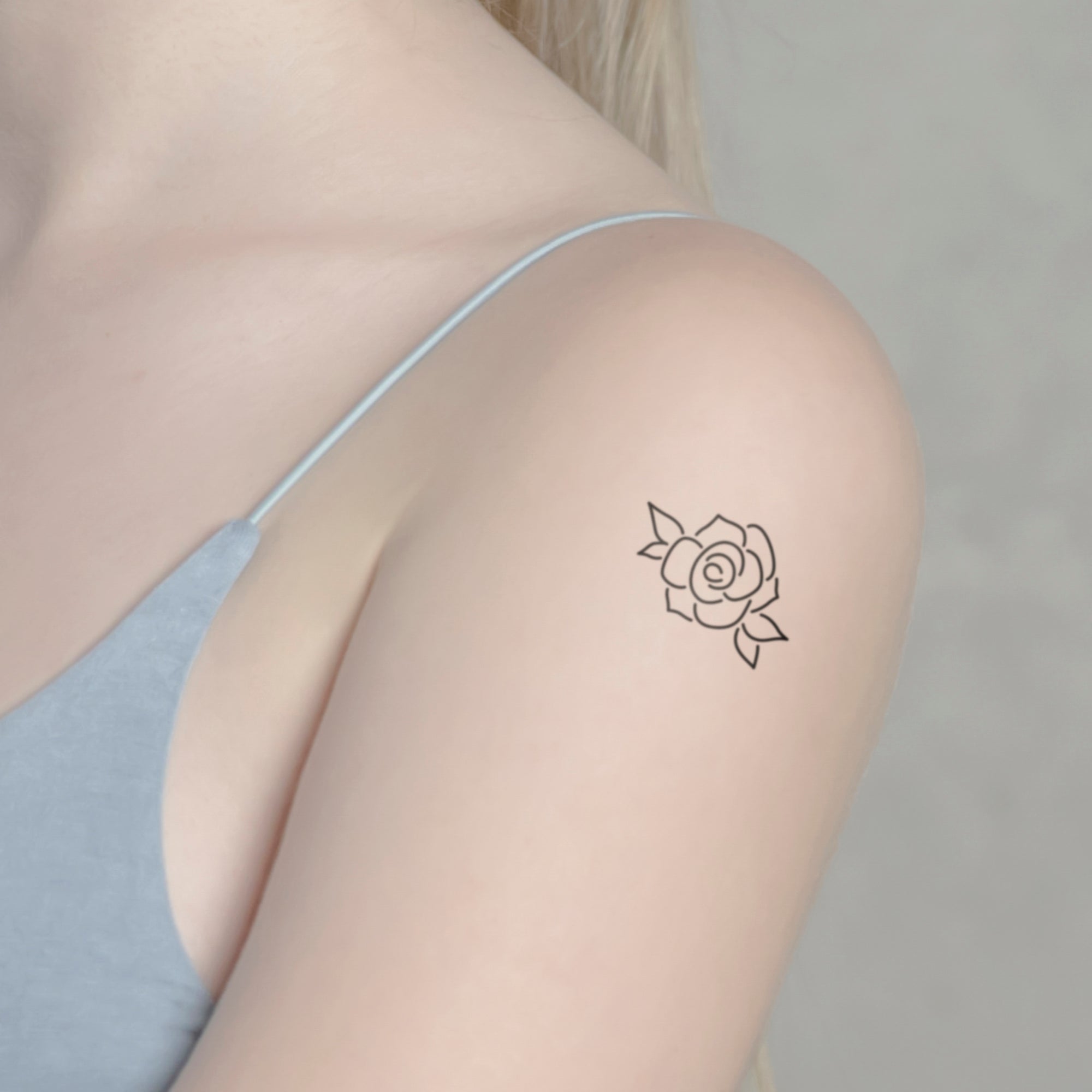 Rosenblüte Tattoo von minink, der Marke für temporäre Tattoos.
