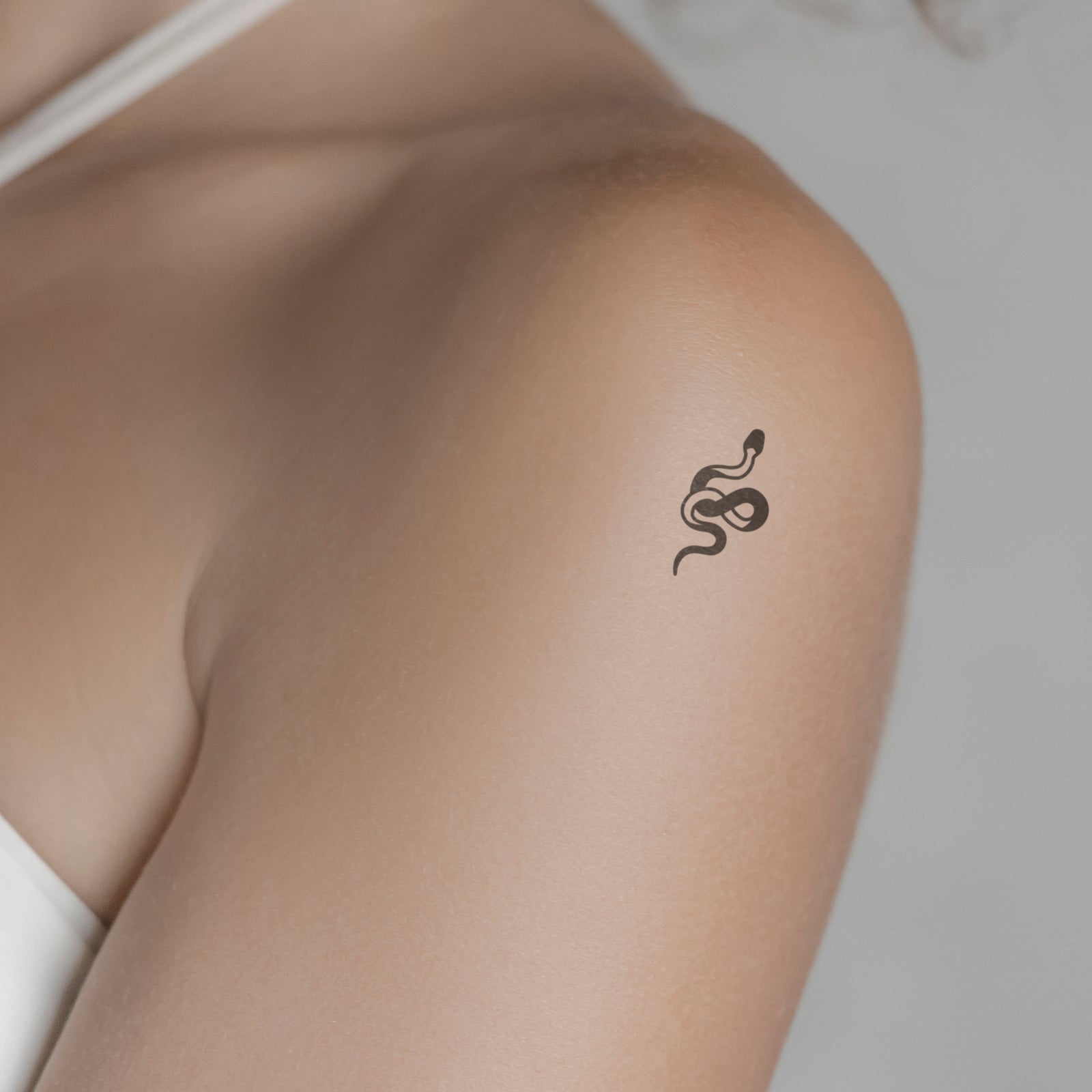 55 Amazing Small Snake Tattoos For 2024!