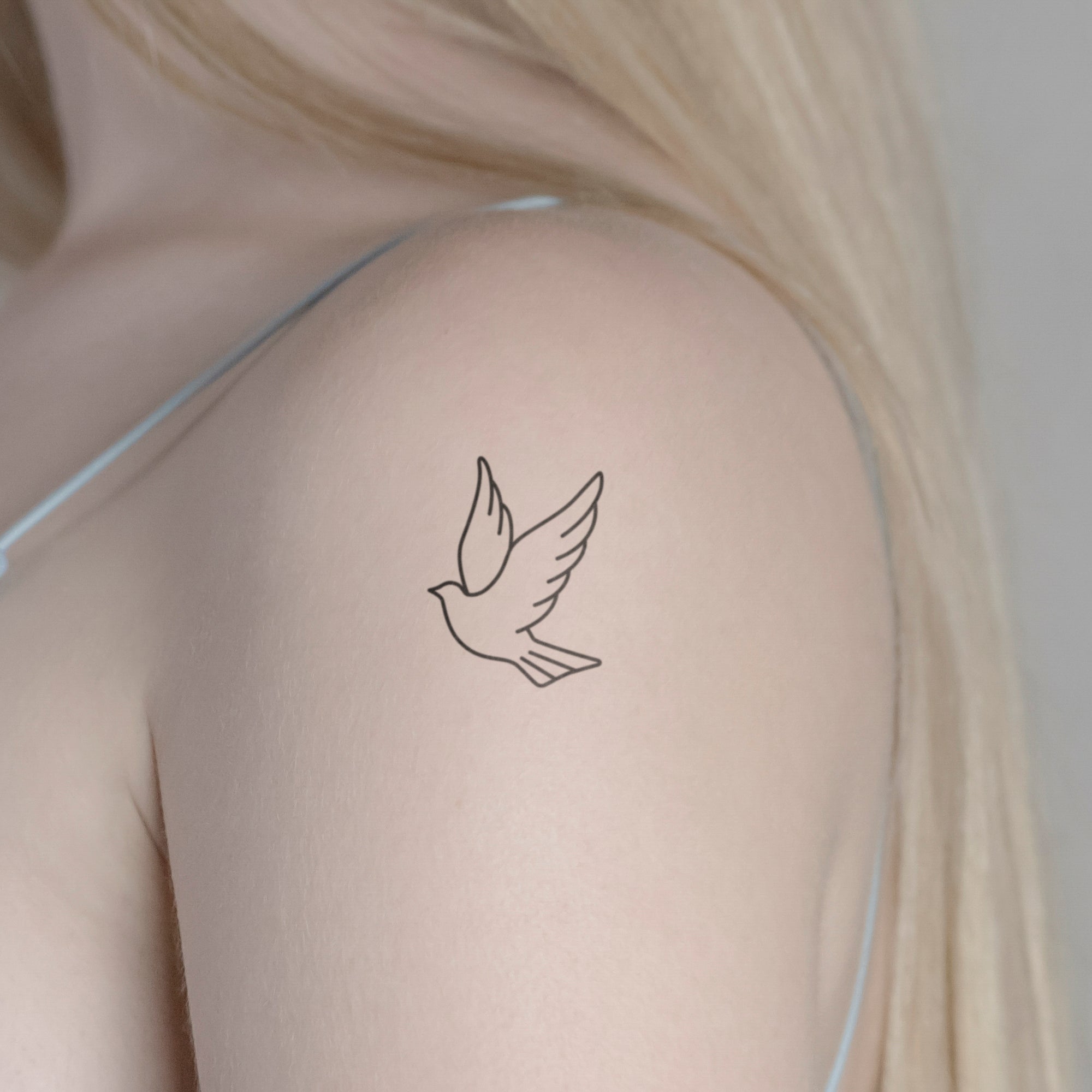 Weisse Taube Tattoo von minink, der Marke für temporäre Tattoos.